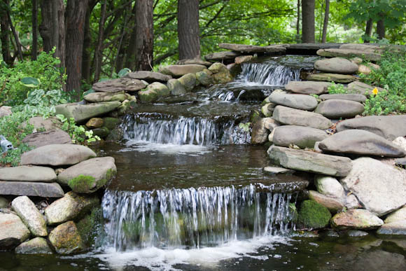 Waterfall feeding into the pond